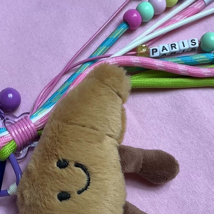 PORTE CLÉS PELUCHE CROISSANT PARISIEN - BIJOU DE SAC AVEC CHARMS